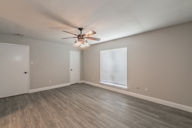 unfurnished room featuring hardwood / wood-style floors and ceiling fan