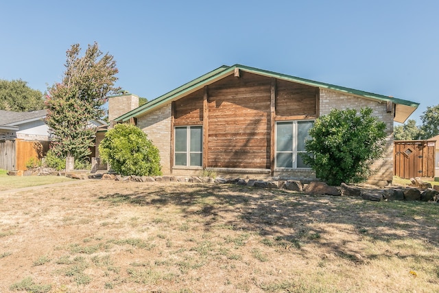 view of property exterior featuring a yard