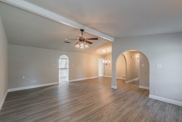 unfurnished room with ceiling fan with notable chandelier, lofted ceiling with beams, and dark hardwood / wood-style flooring