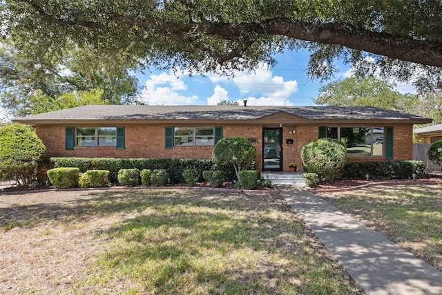 ranch-style home featuring a front yard