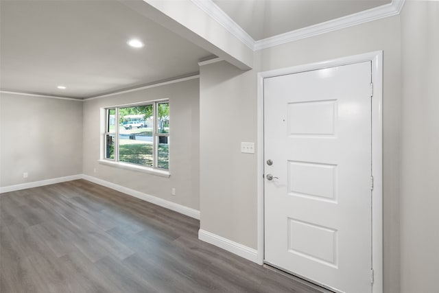 foyer entrance with ornamental molding and hardwood / wood-style floors