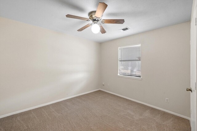 unfurnished room with carpet floors and ceiling fan