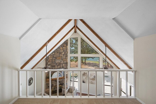 additional living space with ceiling fan, high vaulted ceiling, beamed ceiling, and carpet