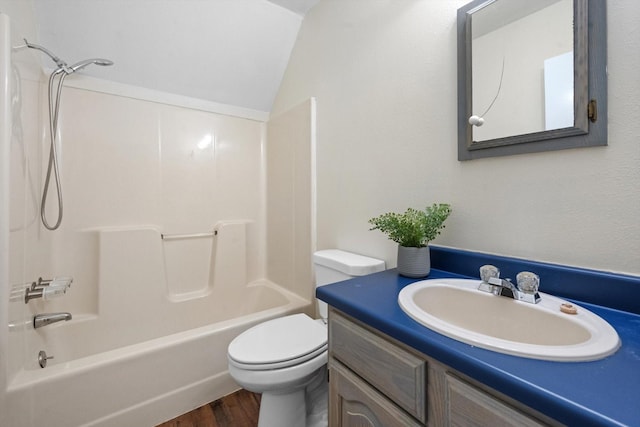 full bathroom featuring hardwood / wood-style flooring, vanity, toilet, and bathing tub / shower combination