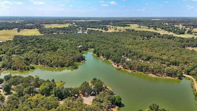 aerial view with a forest view and a water view