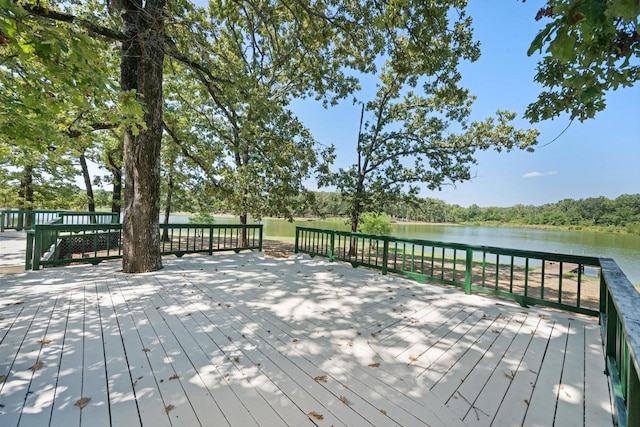 wooden deck with a water view