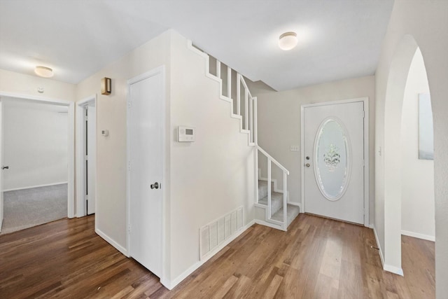 foyer entrance with hardwood / wood-style flooring