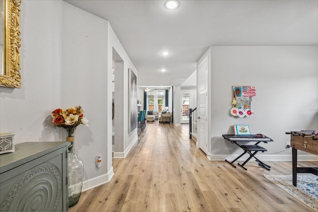 corridor featuring light hardwood / wood-style floors