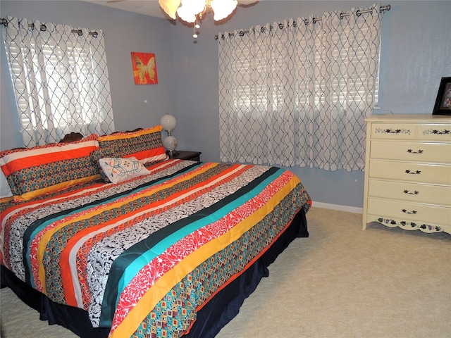 bedroom featuring light colored carpet