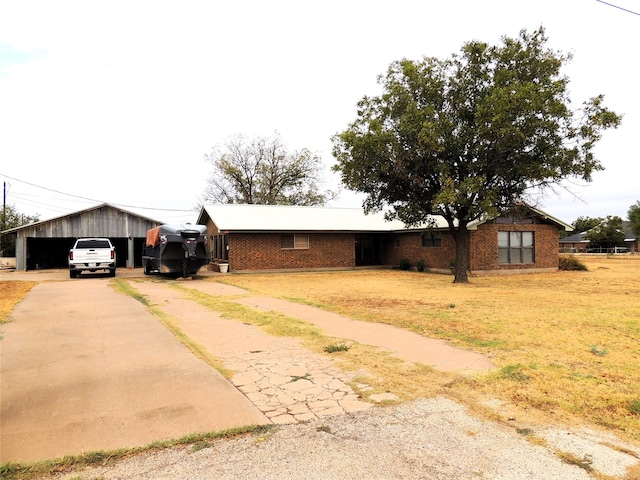 ranch-style home featuring a front yard