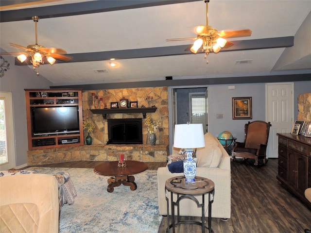 living room with plenty of natural light, ceiling fan, and a fireplace