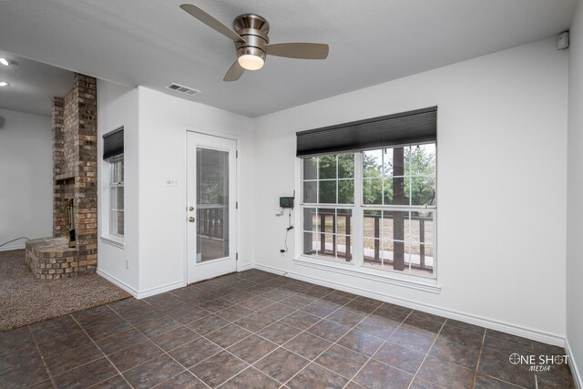 kitchen with dishwasher, black fridge, sink, ceiling fan, and decorative backsplash