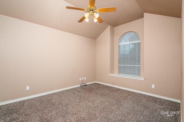 empty room featuring a tray ceiling, ceiling fan, built in features, and carpet floors