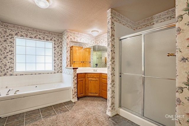 bathroom featuring tile patterned flooring, vanity, and a bath