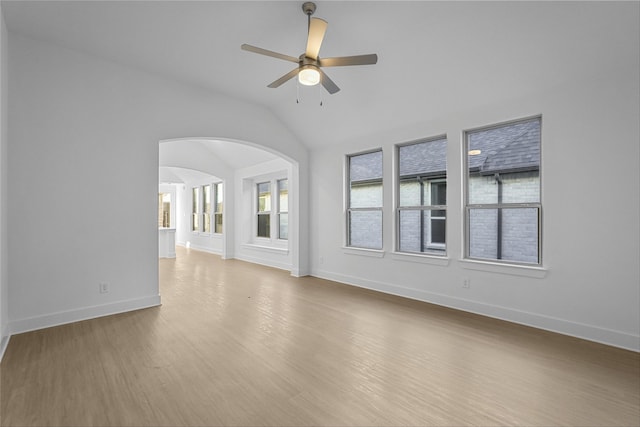 unfurnished living room featuring wood-type flooring, ceiling fan, and lofted ceiling