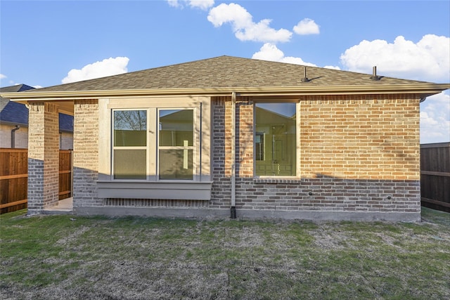 view of home's exterior with a yard