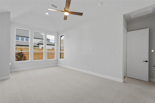 empty room featuring ceiling fan and light carpet