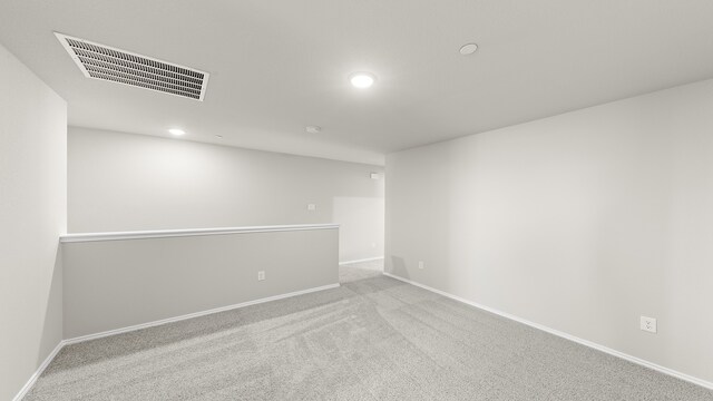 empty room with light colored carpet