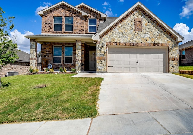 craftsman house featuring a garage, a porch, and a front lawn