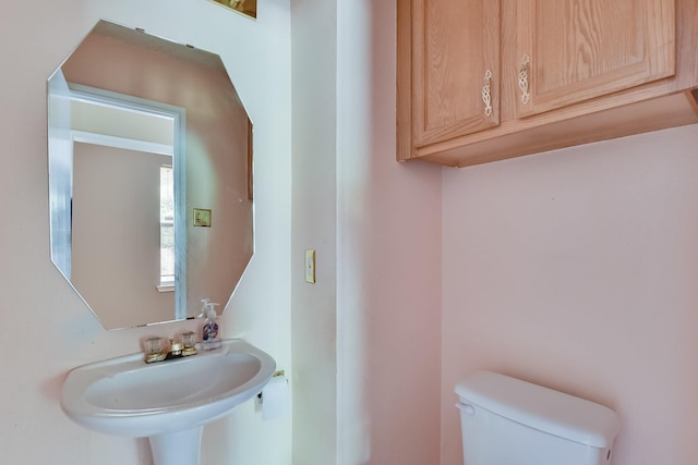 bathroom with toilet and sink