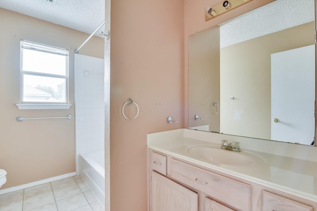 full bathroom featuring toilet, tile patterned floors, vanity, a textured ceiling, and tub / shower combination