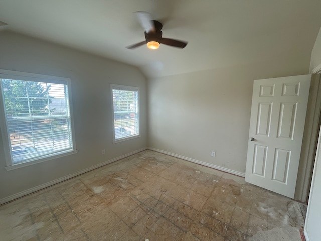 spare room with lofted ceiling and ceiling fan