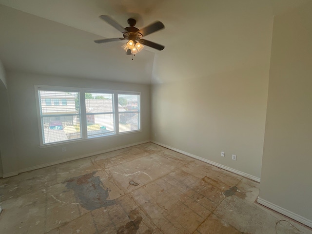 unfurnished room featuring vaulted ceiling and ceiling fan