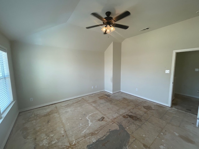 unfurnished room with plenty of natural light, vaulted ceiling, and ceiling fan