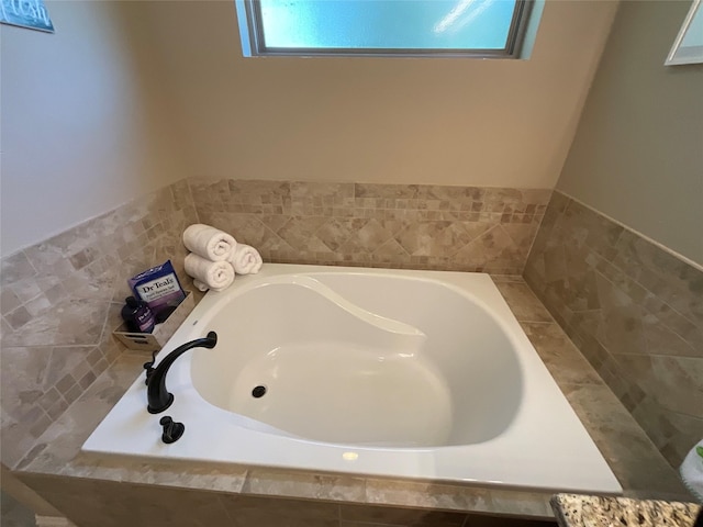 bathroom featuring tiled bath