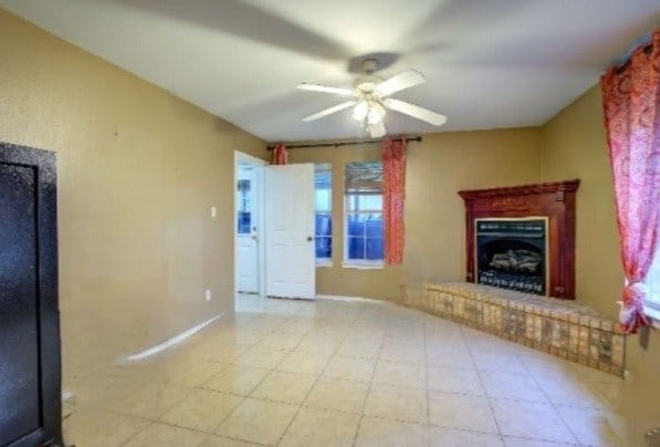 unfurnished living room featuring ceiling fan