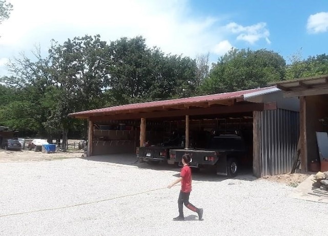 view of parking with a carport