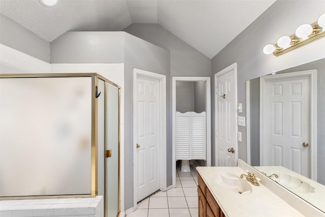 bathroom with an enclosed shower, a textured ceiling, vaulted ceiling, and tile patterned flooring