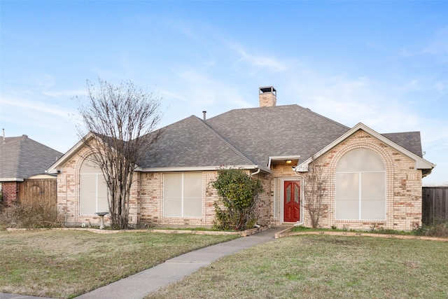 single story home with a front yard