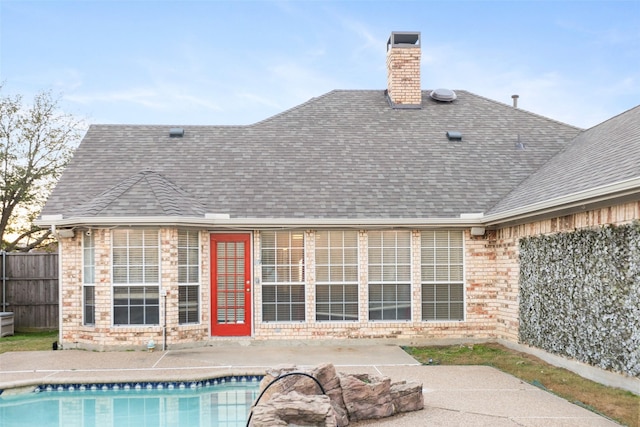 back of house with a patio and a fenced in pool