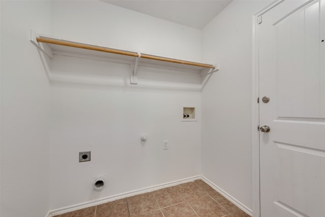 clothes washing area with hookup for a washing machine, gas dryer hookup, tile patterned floors, and electric dryer hookup