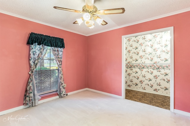 spare room with a textured ceiling, ceiling fan, and carpet floors