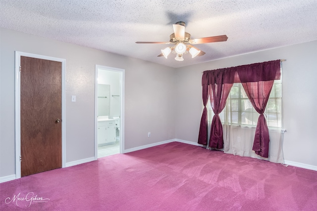 unfurnished room with a textured ceiling, ceiling fan, and carpet flooring