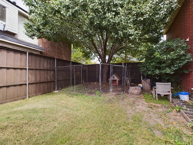 rear view of house featuring a garage, central AC unit, and a lawn