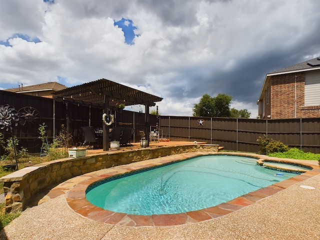 view of pool featuring an in ground hot tub, a patio area, and a pergola