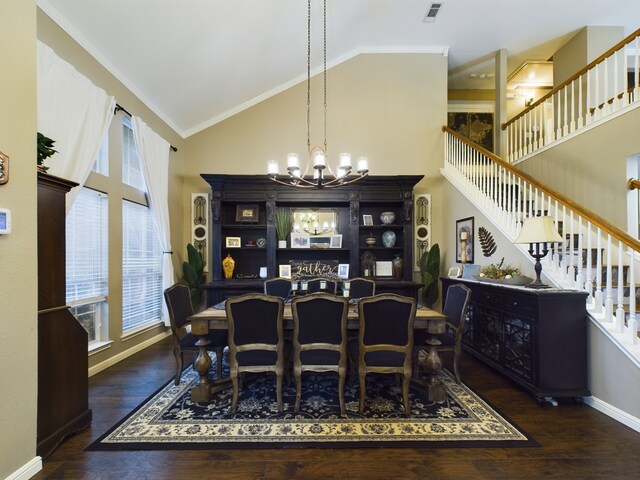 kitchen with black refrigerator with ice dispenser, washing machine and clothes dryer, sink, hanging light fixtures, and gas range oven