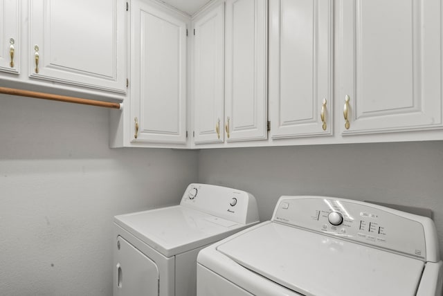 laundry area with cabinet space and washer and dryer