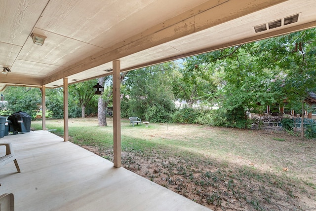 view of patio featuring visible vents and a grill