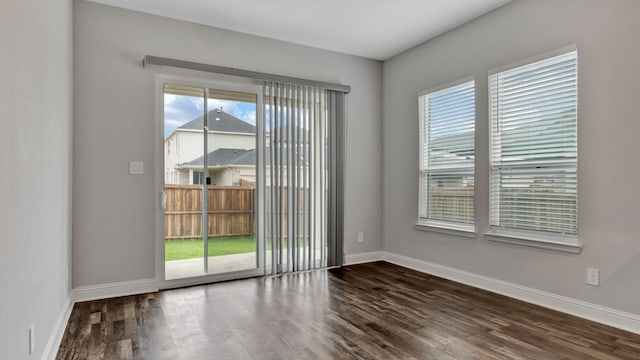 empty room featuring dark hardwood / wood-style floors