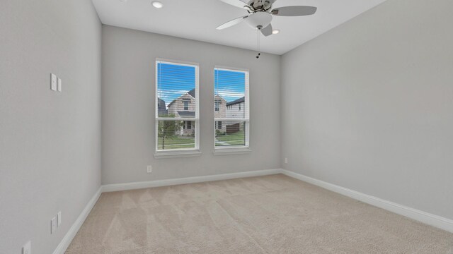 carpeted empty room with ceiling fan