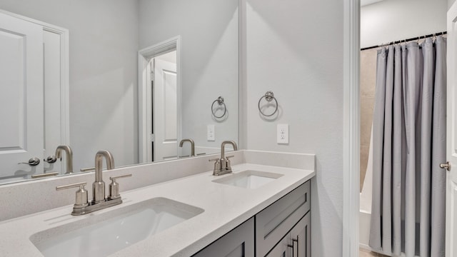 bathroom with vanity and shower / bathtub combination with curtain