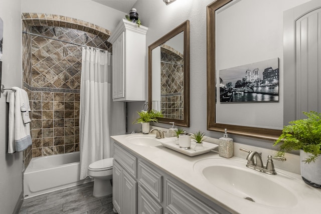 full bathroom with shower / tub combo with curtain, vanity, hardwood / wood-style floors, and toilet