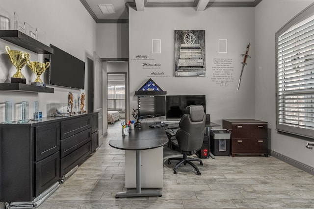 office space with light hardwood / wood-style flooring, ornamental molding, a healthy amount of sunlight, and beamed ceiling