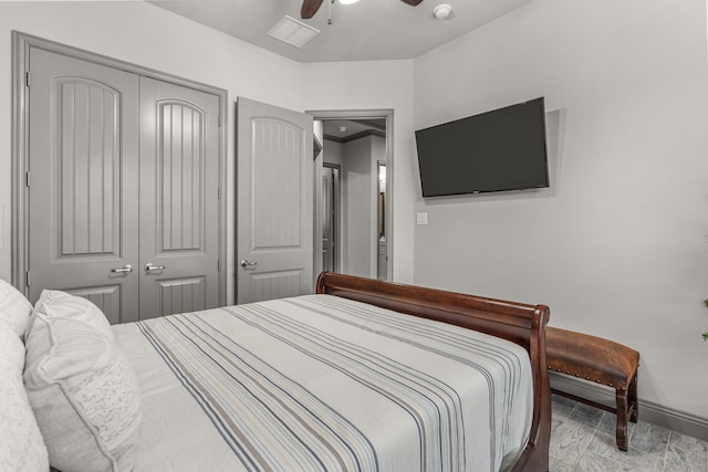 bedroom featuring ceiling fan and a closet