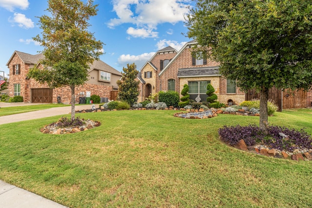 english style home with a front lawn