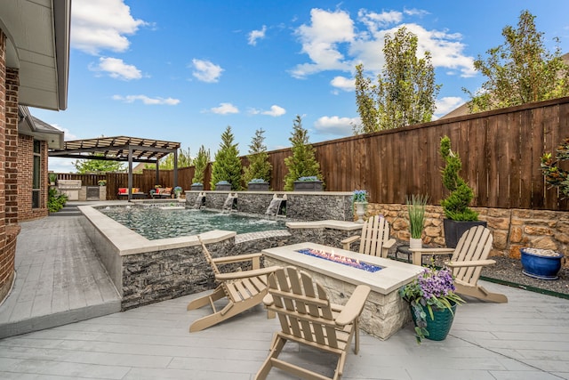 view of patio / terrace with pool water feature, a swimming pool side deck, a fire pit, and a pergola